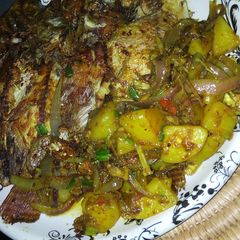 A picture of Pan grilled Tilapia and potatoes.
