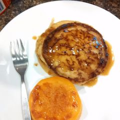 A picture of Sourdough Kamut pancake with butter almond milk syrup.