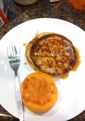 A picture of Sourdough Kamut pancake with butter almond milk syrup.
