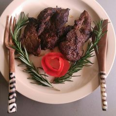 A picture of Marinated pan fried beef steak.