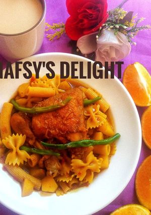 A picture of Macaroni n potato jollof with Nescafe.