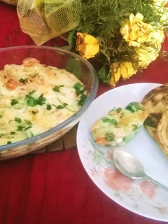 A picture of Baked veggies in white sauce.