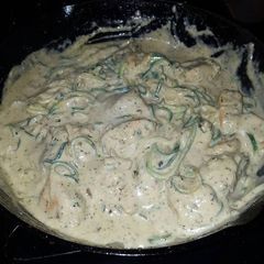 A picture of Zucchini Noodles with Pesto Chicken and Garlic Alfredo sauce.