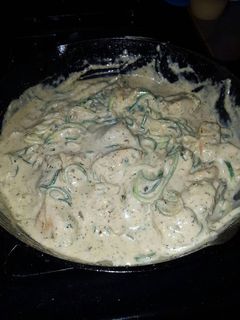 A picture of Zucchini Noodles with Pesto Chicken and Garlic Alfredo sauce.