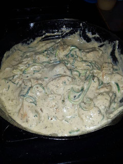 A picture of Zucchini Noodles with Pesto Chicken and Garlic Alfredo sauce.