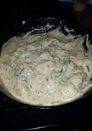 A picture of Zucchini Noodles with Pesto Chicken and Garlic Alfredo sauce.