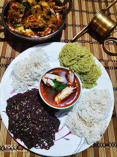 A picture of Colourful Stringhoppers with Crab stew.