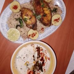 A picture of 🐟 fish pulao and okra ratia.