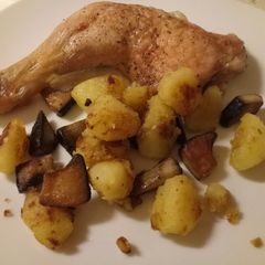 A picture of Crispy chicken with sautéed potatoes and porcini mushrooms.