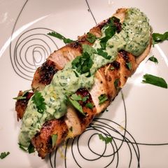 A picture of Pan-seared chicken with cilantro dill cream.