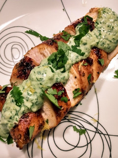 A picture of Pan-seared chicken with cilantro dill cream.