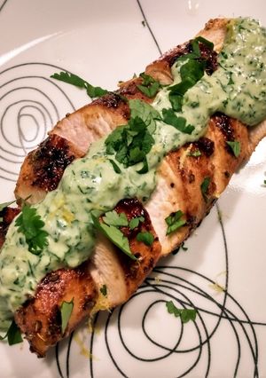 A picture of Pan-seared chicken with cilantro dill cream.