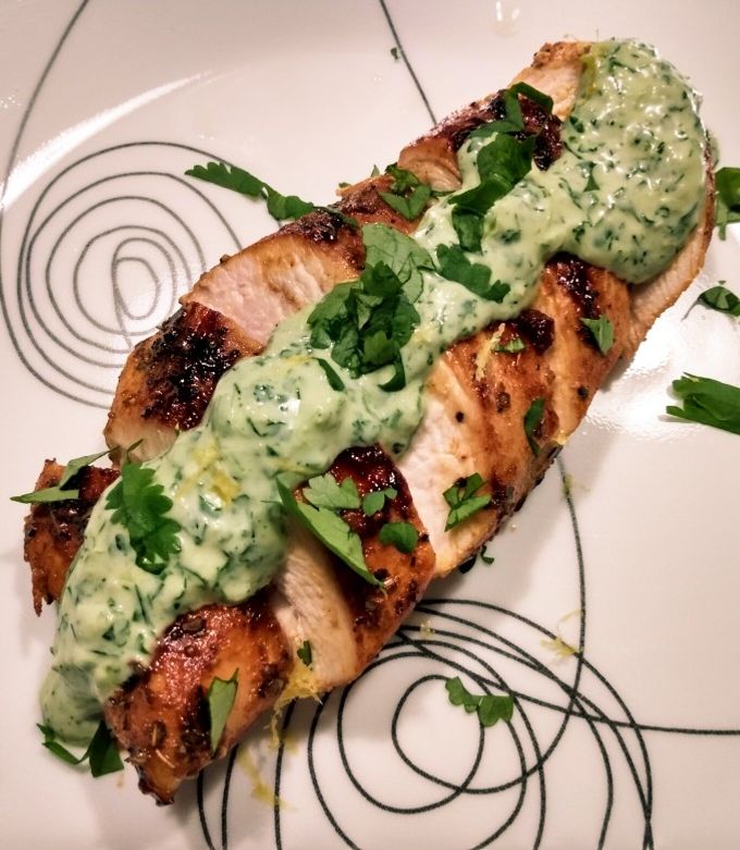 A picture of Pan-seared chicken with cilantro dill cream.