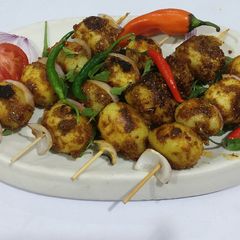 Anari dry Dum Aalu in skewers A picture of Anari dry Dum Aalu in skewers.
