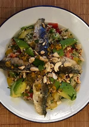 A picture of Fresh sardines with Tabbouleh Salad.
