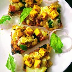 A picture of Paneer tikka cheese burst pizza.