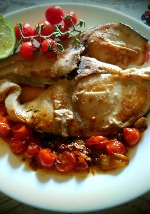 A picture of Slice of grilled swordfish in cherry tomato sauce😋😋👍😛.