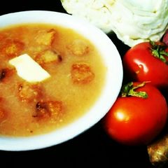 A picture of Cabbage and tomato soup.