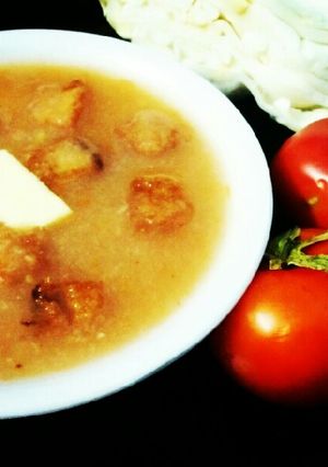 A picture of Cabbage and tomato soup.