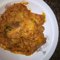 A picture of Yam porridge and moringa.