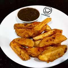 A picture of Crispy potato wedges with mint tomato chutni.