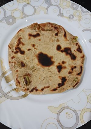A picture of Sattu and green onion paratha.