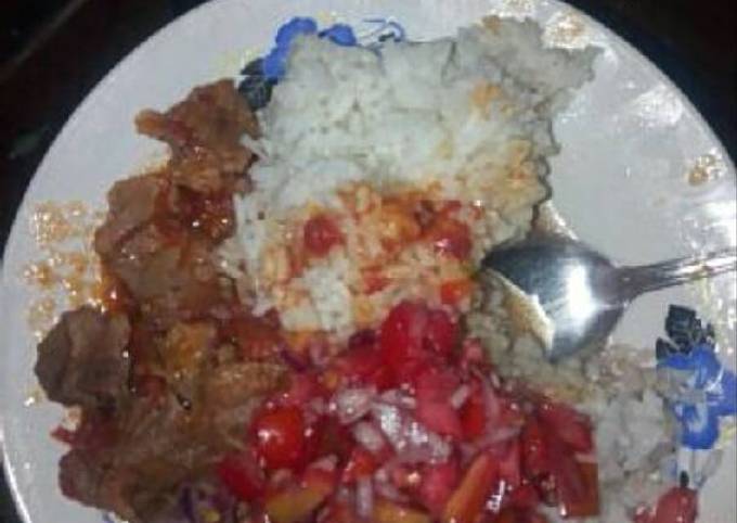 Rice fried meat and kachumbari