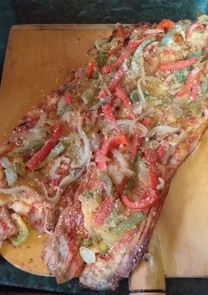 Una foto de Matambre a la pizza con cebolla y morrón salteado