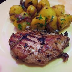 A picture of Pan grilled chicken with garlic potatoes.