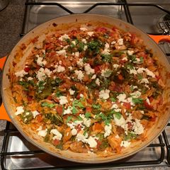 A picture of Greek Orzo with chicken and kale.