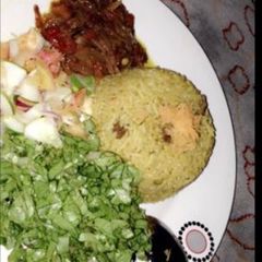 Fried rice with salad and sauce A picture of Fried rice with salad and sauce.