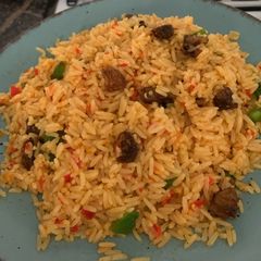 A picture of Asun fried rice | goat meat rice.