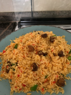 A picture of Asun fried rice | goat meat rice.