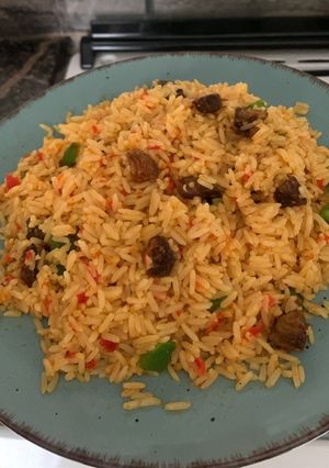 A picture of Asun fried rice | goat meat rice.
