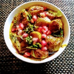 A picture of Dahi Baingan with roasted cumins powder.