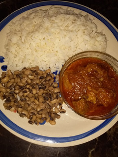 A picture of White rice beans and stew.