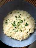 Risotto succo d’arancia, taleggio e prezzemolo