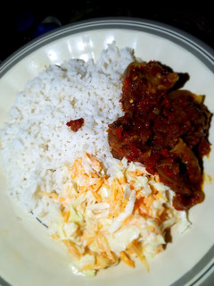 A picture of Rice stew and coleslaw.