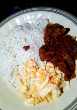 A picture of Rice stew and coleslaw.