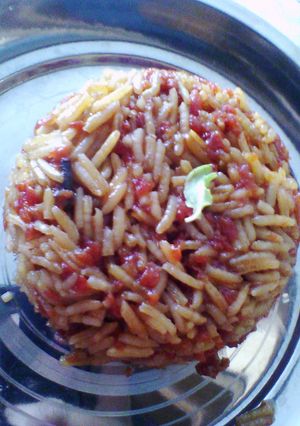 A picture of Gud gajar rice (jaggery carrot rice).