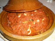 Una foto de langostinos en su jugo al horno