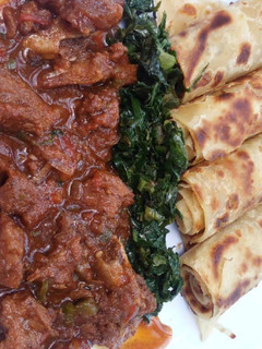 A picture of Beef Stew and Chapati.