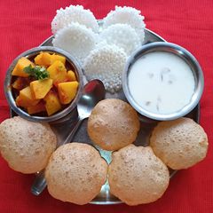 A picture of Dudhapak, Puri and Gravy Potato.