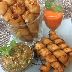 A picture of Baby corn twister with salsa sauce.