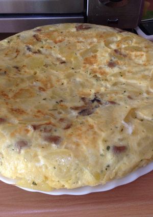 Una foto de Tortilla con champis y queso