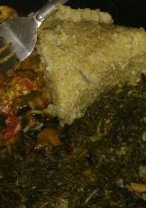 A picture of Stewed Lung fish (Kamongo) with ugali & managu.