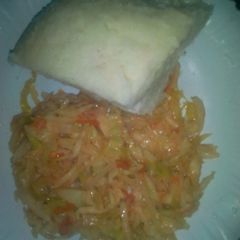 A picture of Fried cabbage and ugali.