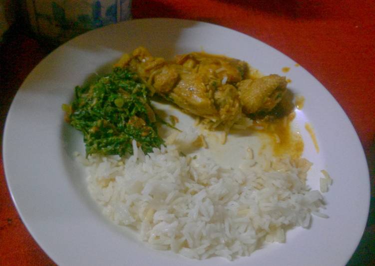 Stewed  chicken served  with rice and greens