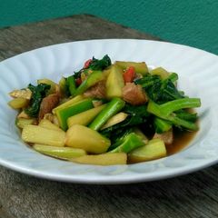 A picture of Sauteed Kale with Crispy Salted Mackerel Fish.