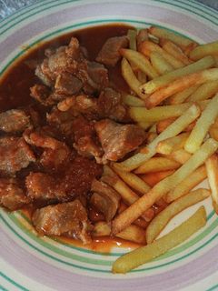 Una foto de Taquitos de carne en salsa de tomate